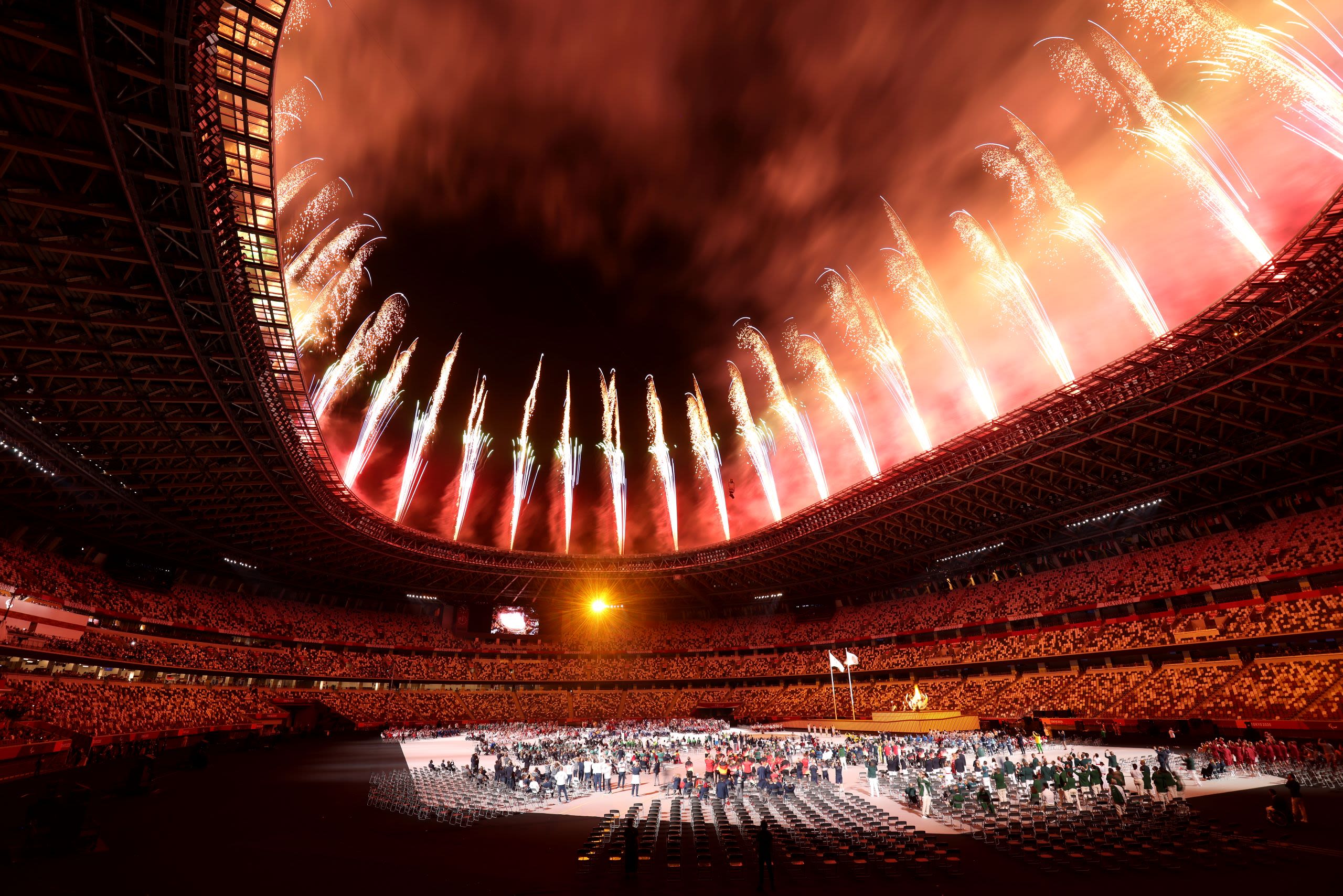 Tokyo 2020(21) Paralympic Games Opening Ceremony taking place, a wide shot showing fireworks being set off from the roof of the stadium