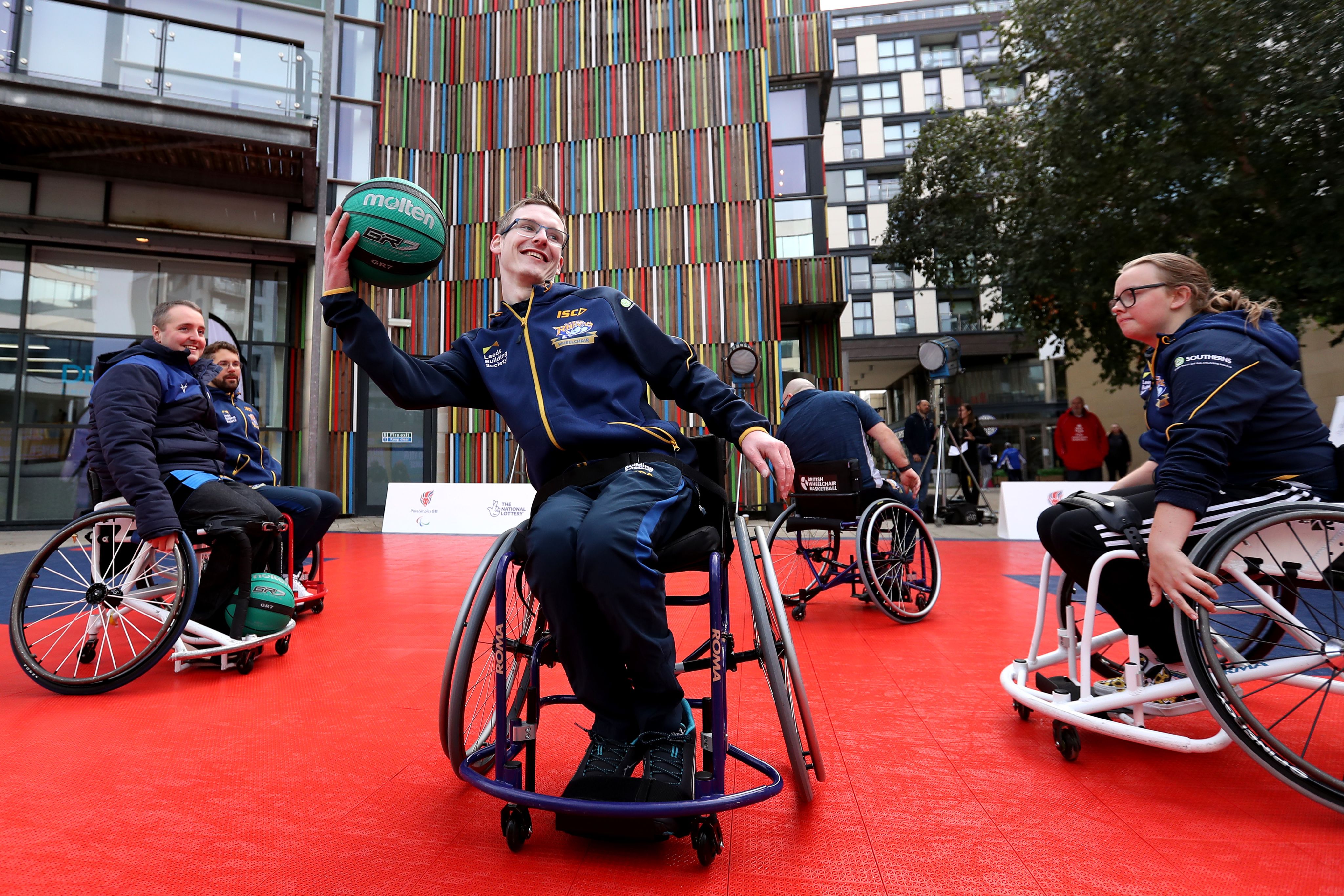 A group of wheelchair basketball players participating in a game
