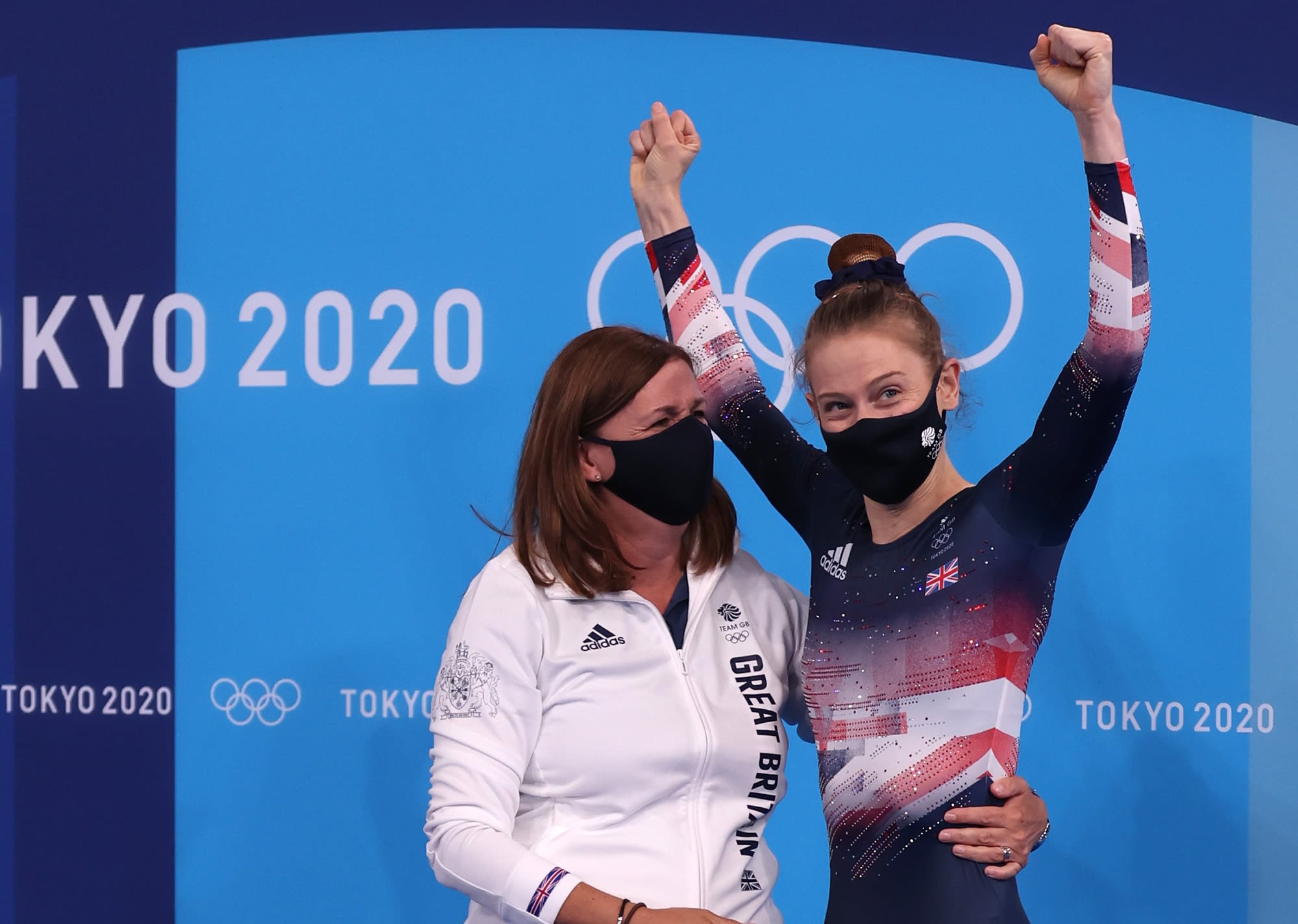 Gymnastics Performance Director Tracy Whittaker-Smith, embracing a gymnast at the end of competition during the Tokyo 2020 Olympics